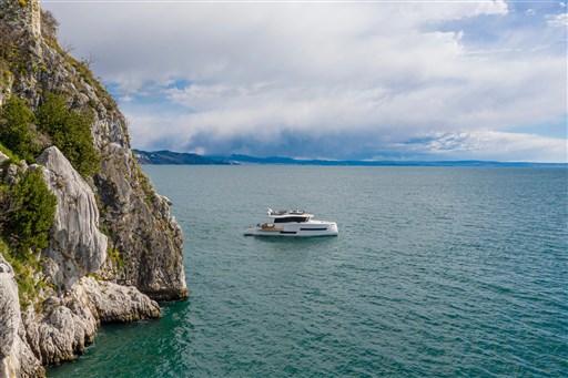 Luxury Pardo Yachts Endurance 60, 2025 model, cruising near rocky coastline.