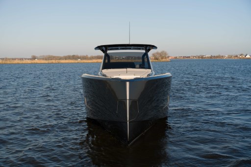 Front view of 2026 Pardo Yachts 43 on calm water under clear sky.
