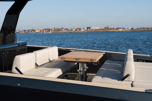 Luxurious seating area on 2026 Pardo Yachts 43, with scenic waterfront view.
