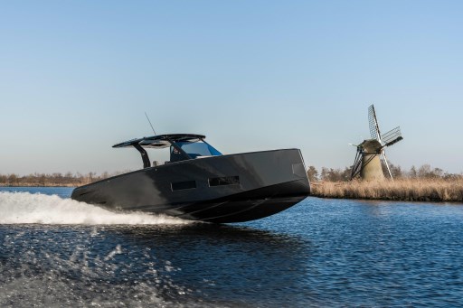 2026 Pardo Yachts 43 cruising on water near a windmill.