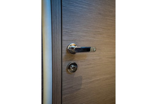 Wooden door with sleek chrome handle on 2026 Pardo Yachts 43 model.
