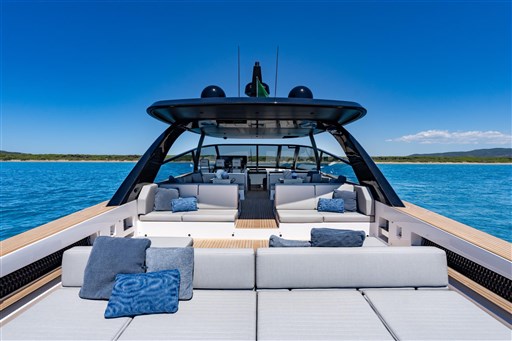 Luxurious 2025 VanDutch 75 yacht with spacious deck and plush seating on open water.
