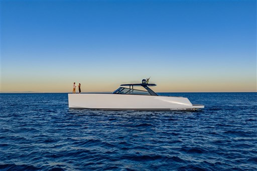 2025 VanDutch 75 yacht cruising on open sea at sunset.