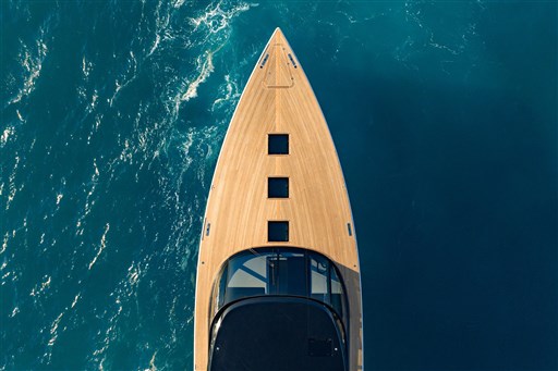 Aerial view of 2025 VanDutch 75 yacht on blue ocean water.