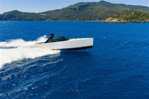 VanDutch 75 yacht cruising in blue ocean near scenic coastline, 2025 model.