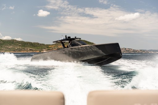 2025 Pardo Yachts 50 cruising on open water with scenic coastal backdrop.