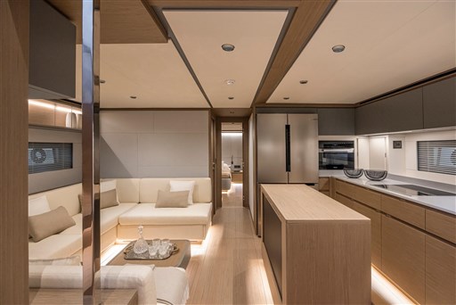 Luxurious interior of 2025 Pardo Yachts GT75, featuring modern kitchen and cozy seating area.