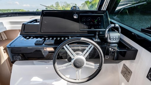 Steering console of 2024 Apreamare GOZZO 38 CABIN with modern controls and navigation display.