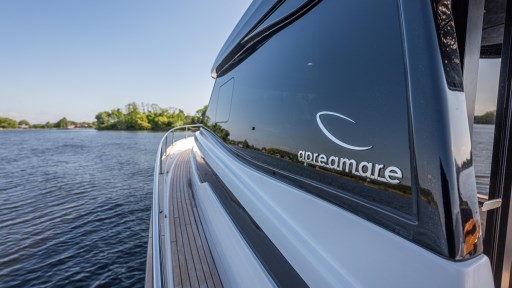 2024 Apreamare GOZZO 38 CABIN yacht on serene water, showcasing sleek design.