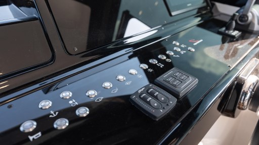 Control panel of 2024 Apreamare GOZZO 38 CABIN yacht, featuring modern buttons and switches.