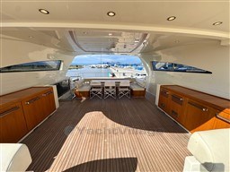 Luxurious 2008 Riva 115 Athena yacht interior with elegant wood finish and spacious seating area.