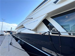 Luxury 2008 Riva 115 Athena yacht docked at marina under clear blue sky.