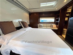 Luxurious bedroom interior of 2008 Riva 115 Athena yacht with elegant furnishings.