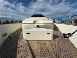 2008 Riva 115 Athena yacht deck with wooden flooring and clear sky.