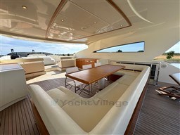 Luxurious 2008 Riva 115 Athena yacht interior with elegant seating and dining area.