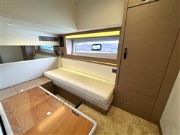 Luxurious interior of a 2019 Prestige 590 yacht with modern furnishings and ample natural light.