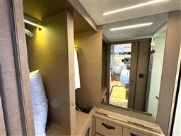 Luxurious interior of 2019 Prestige 590 yacht with modern wood finishes and ample storage.