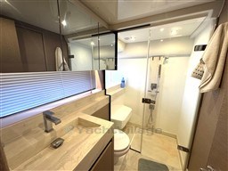 Luxurious bathroom in 2019 Prestige 590 yacht with modern fixtures and glass shower.