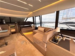 Luxurious interior of a 2019 Prestige 590 yacht with elegant seating and modern decor.