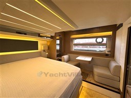 Luxurious interior of a 2019 Prestige 590 yacht with modern furnishings and ambient lighting.