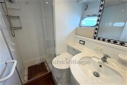 Bathroom interior of 1989 Mochi Craft MOCHI 56 yacht with shower and sink.