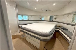 Luxurious bedroom interior of 1989 Mochi Craft MOCHI 56 yacht with modern design.