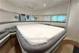 Luxurious bedroom interior of 1989 Mochi Craft MOCHI 56 yacht with modern design.