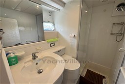 Bathroom interior of 1989 Mochi Craft MOCHI 56 yacht with sink and shower.