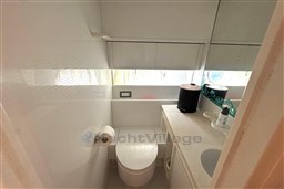 Bathroom interior of 1989 Mochi Craft MOCHI 56 yacht, featuring modern fixtures and storage.