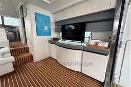 Luxurious interior of 1989 Mochi Craft MOCHI 56 yacht with modern decor and entertainment setup.