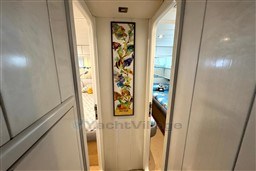 Hallway inside 1989 Mochi Craft MOCHI 56 yacht with colorful fish artwork.