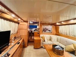 Luxurious interior of a 1996 Sanlorenzo 62 yacht with elegant furnishings and decor.