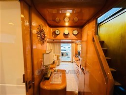Luxurious interior of a 1996 Sanlorenzo 62 yacht with elegant wood finishes.