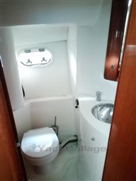 Bathroom interior of 2005 Jeanneau Prestige 34 S yacht, featuring toilet and sink.
