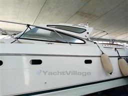 2005 Jeanneau Prestige 34 S yacht in a covered storage area.