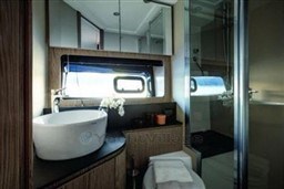 Luxurious bathroom interior of 2025 Azimut Atlantis 45 yacht with modern fixtures.