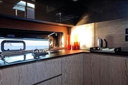 Modern kitchen interior of 2025 Azimut Atlantis 45 yacht with sleek design and ocean view.