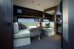 Luxurious interior of 2025 Azimut Atlantis 45 yacht with elegant seating and dining area.