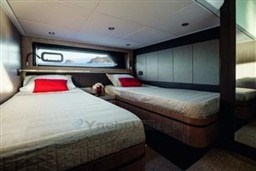 Luxurious 2025 Azimut Atlantis 45 yacht cabin with twin beds and modern decor.