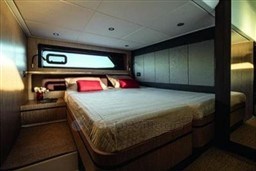 Luxurious bedroom interior of 2025 Azimut Atlantis 45 yacht with modern design and elegant decor.