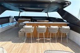 Luxurious 2024 Sanlorenzo SL120 A yacht deck with stylish bar and seating.