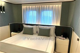 Luxurious bedroom interior of 2024 Sanlorenzo SL120 A yacht, featuring elegant design and cozy ambiance.