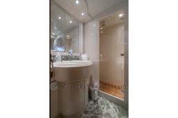 Luxurious bathroom in 1999 Mangusta 105 Sport yacht with elegant fixtures and shower.