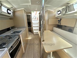 Interior of 2021 Beneteau Oceanis 38.1 yacht, featuring modern kitchen and dining area.