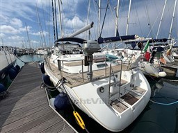2001 Beneteau Oceanis 40 CC sailboat docked at marina, surrounded by other vessels.