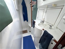 Bathroom interior of 2001 Beneteau Oceanis 40 CC yacht, featuring sink and shower area.