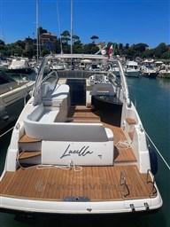 Rio Yachts Rio 36, 2013 model, docked in a marina with wooden deck.