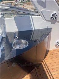 Outdoor kitchenette on 2013 Rio Yachts Rio 36, featuring sink and cooktop.