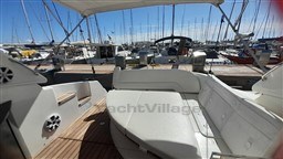 2013 Rio Yachts Rio 36 interior with white seating, docked at a marina.