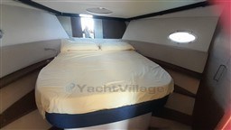 Cabin interior of 2013 Rio Yachts Rio 36 with a cozy bed and porthole window.
